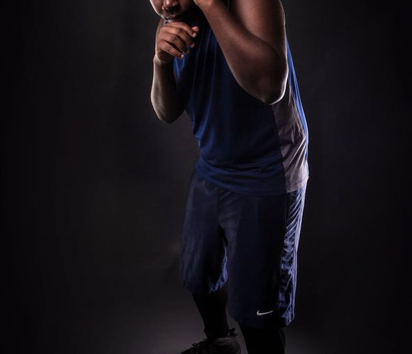 Man in a power stance showing controlled strength.